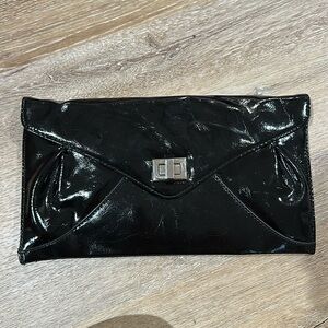 Cato women’s clutch. Black shiny leather 13x7 in
